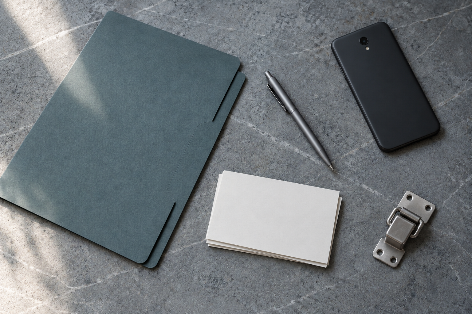 Blank question cards, a record folder, a carrier latch, and a phone form a neutral preparation still life.